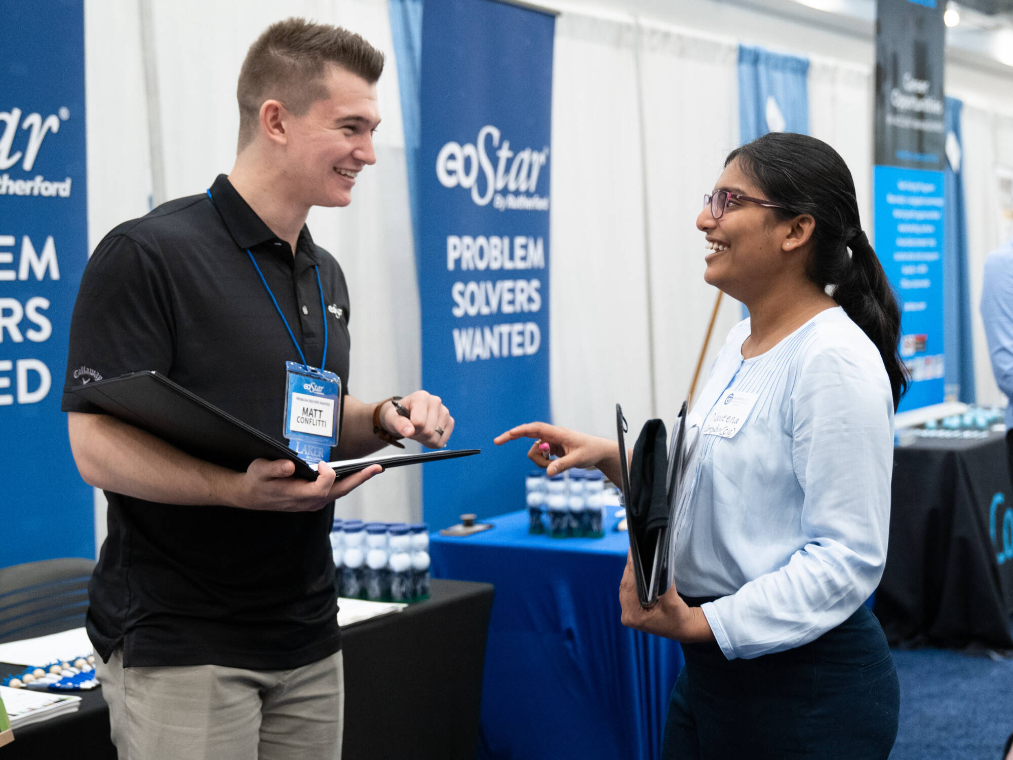 two people networking at the career fair